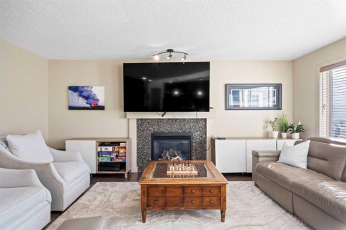 80 Tuscany Summit Terrace Nw, Calgary, AB - Indoor Photo Showing Living Room With Fireplace