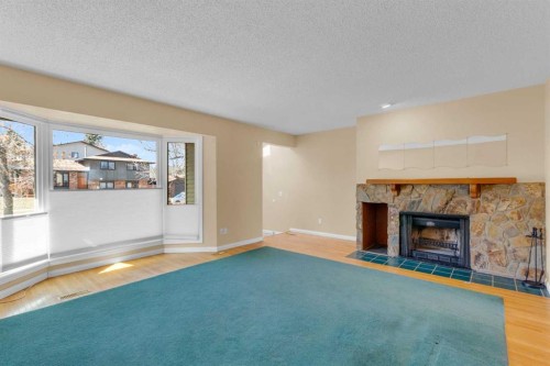 604 Strathcona Drive Sw, Calgary, AB - Indoor Photo Showing Living Room With Fireplace