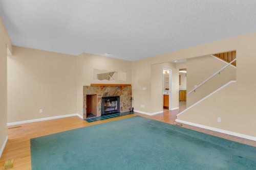 604 Strathcona Drive Sw, Calgary, AB - Indoor Photo Showing Living Room With Fireplace