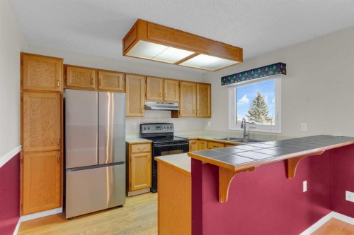 604 Strathcona Drive Sw, Calgary, AB - Indoor Photo Showing Kitchen With Double Sink