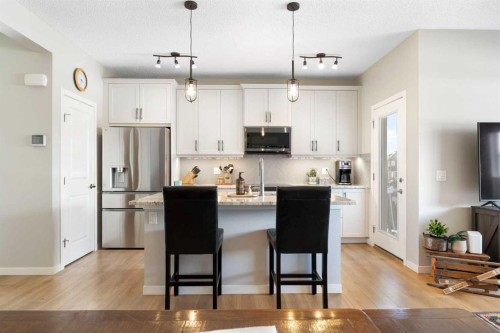 46 Emberside Place, Cochrane, AB - Indoor Photo Showing Kitchen With Stainless Steel Kitchen With Upgraded Kitchen