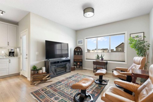 46 Emberside Place, Cochrane, AB - Indoor Photo Showing Living Room