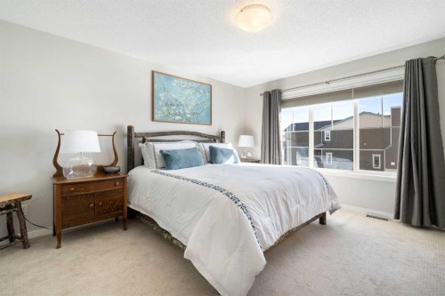 46 Emberside Place, Cochrane, AB - Indoor Photo Showing Bedroom