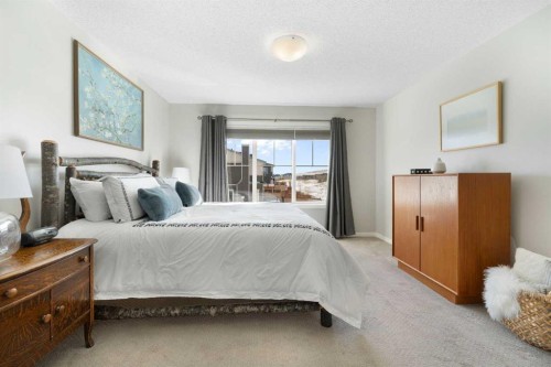 46 Emberside Place, Cochrane, AB - Indoor Photo Showing Bedroom