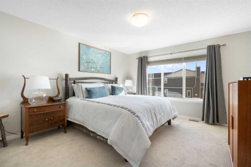 46 Emberside Place, Cochrane, AB - Indoor Photo Showing Bedroom