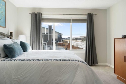 46 Emberside Place, Cochrane, AB - Indoor Photo Showing Bedroom