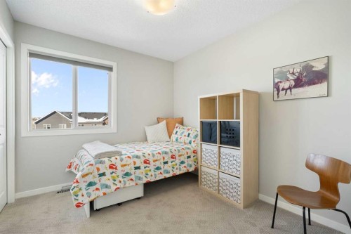 46 Emberside Place, Cochrane, AB - Indoor Photo Showing Bedroom