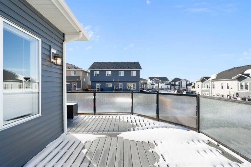 46 Emberside Place, Cochrane, AB - Outdoor With Body Of Water With Deck Patio Veranda With Exterior