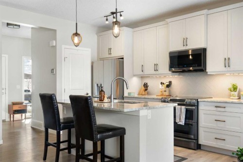 46 Emberside Place, Cochrane, AB - Indoor Photo Showing Kitchen With Upgraded Kitchen
