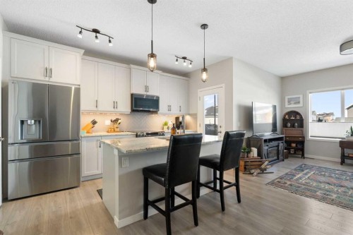 46 Emberside Place, Cochrane, AB - Indoor Photo Showing Kitchen With Stainless Steel Kitchen With Upgraded Kitchen