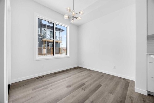 66 Creekside Way Sw, Calgary, AB - Indoor Photo Showing Other Room