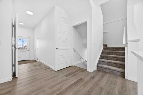 66 Creekside Way Sw, Calgary, AB - Indoor Photo Showing Other Room