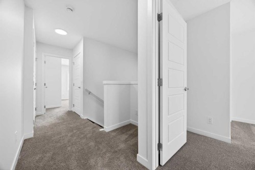 66 Creekside Way Sw, Calgary, AB - Indoor Photo Showing Other Room
