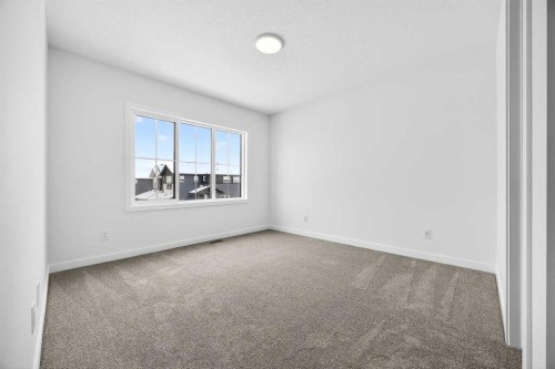 66 Creekside Way Sw, Calgary, AB - Indoor Photo Showing Other Room