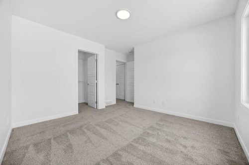 66 Creekside Way Sw, Calgary, AB - Indoor Photo Showing Other Room