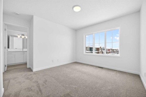66 Creekside Way Sw, Calgary, AB - Indoor Photo Showing Other Room