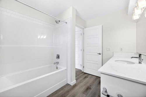 66 Creekside Way Sw, Calgary, AB - Indoor Photo Showing Bathroom