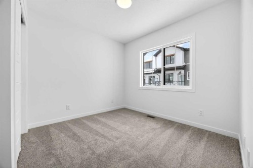 66 Creekside Way Sw, Calgary, AB - Indoor Photo Showing Other Room