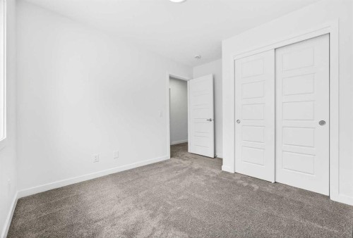66 Creekside Way Sw, Calgary, AB - Indoor Photo Showing Other Room