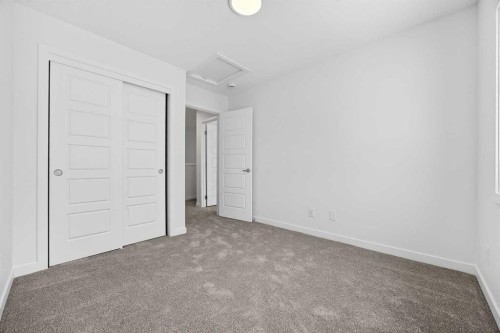 66 Creekside Way Sw, Calgary, AB - Indoor Photo Showing Other Room