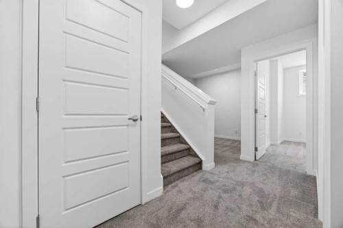 66 Creekside Way Sw, Calgary, AB - Indoor Photo Showing Other Room