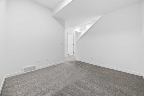 66 Creekside Way Sw, Calgary, AB - Indoor Photo Showing Other Room