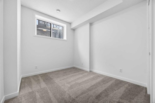 66 Creekside Way Sw, Calgary, AB - Indoor Photo Showing Other Room