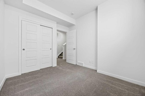 66 Creekside Way Sw, Calgary, AB - Indoor Photo Showing Other Room
