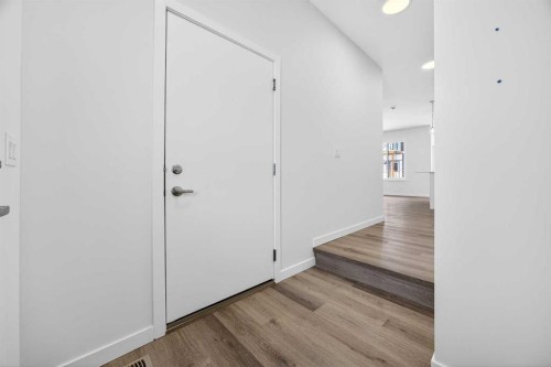 66 Creekside Way Sw, Calgary, AB - Indoor Photo Showing Other Room