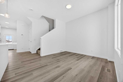 66 Creekside Way Sw, Calgary, AB - Indoor Photo Showing Other Room