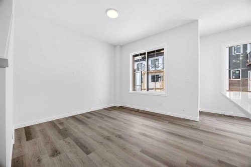 66 Creekside Way Sw, Calgary, AB - Indoor Photo Showing Other Room