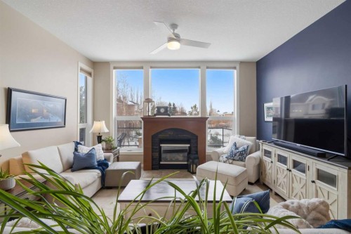 71 Elgin Estates Hill Se, Calgary, AB - Indoor Photo Showing Living Room With Fireplace