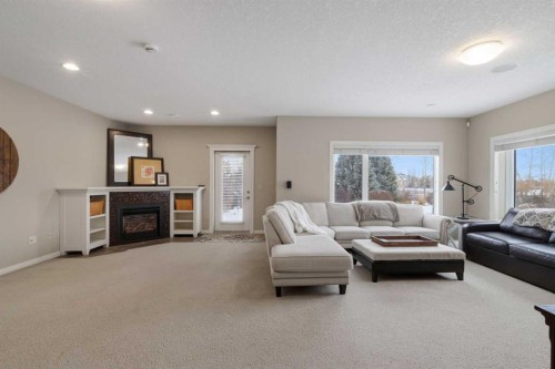 71 Elgin Estates Hill Se, Calgary, AB - Indoor Photo Showing Living Room With Fireplace