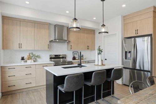 45 Wild Rose Way Se, Calgary, AB - Indoor Photo Showing Kitchen With Stainless Steel Kitchen With Upgraded Kitchen