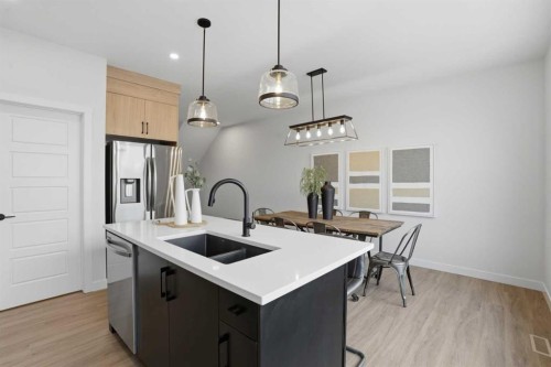 45 Wild Rose Way Se, Calgary, AB - Indoor Photo Showing Kitchen With Double Sink With Upgraded Kitchen