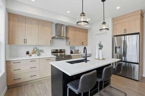 45 Wild Rose Way Se, Calgary, AB - Indoor Photo Showing Kitchen With Stainless Steel Kitchen With Double Sink