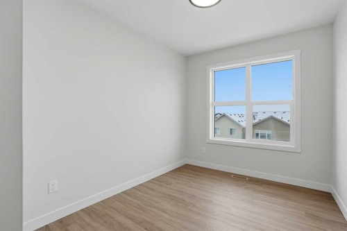 45 Wild Rose Way Se, Calgary, AB - Indoor Photo Showing Other Room