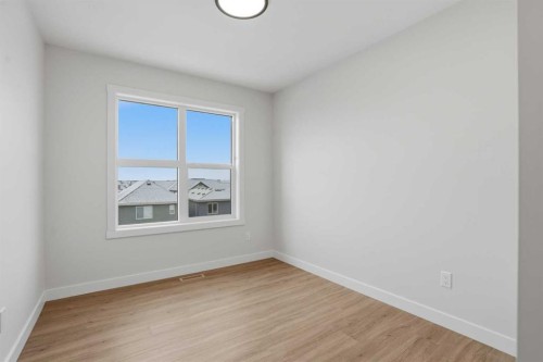 45 Wild Rose Way Se, Calgary, AB - Indoor Photo Showing Other Room