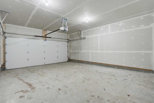 45 Wild Rose Way Se, Calgary, AB - Indoor Photo Showing Garage