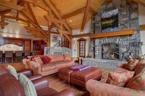 145 Silvertip Ridge, Canmore, AB - Indoor Photo Showing Living Room With Fireplace