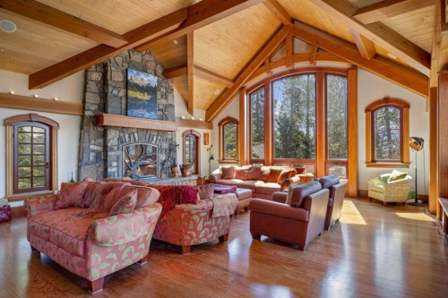 145 Silvertip Ridge, Canmore, AB - Indoor Photo Showing Living Room With Fireplace