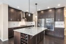 26 Mount Rae Terrace, Okotoks, AB  - Indoor Photo Showing Kitchen With Double Sink With Upgraded Kitchen 