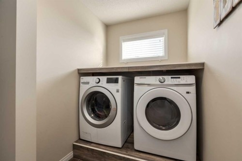 26 Mount Rae Terrace, Okotoks, AB - Indoor Photo Showing Laundry Room