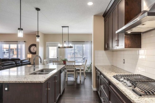 26 Mount Rae Terrace, Okotoks, AB - Indoor Photo Showing Kitchen With Double Sink With Upgraded Kitchen