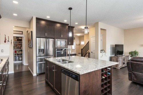 26 Mount Rae Terrace, Okotoks, AB - Indoor Photo Showing Kitchen With Double Sink With Upgraded Kitchen