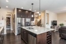 26 Mount Rae Terrace, Okotoks, AB  - Indoor Photo Showing Kitchen With Double Sink With Upgraded Kitchen 