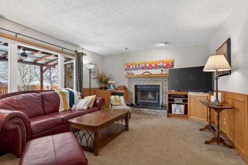 204 Sunrise Circle Se, Calgary, AB - Indoor Photo Showing Living Room With Fireplace