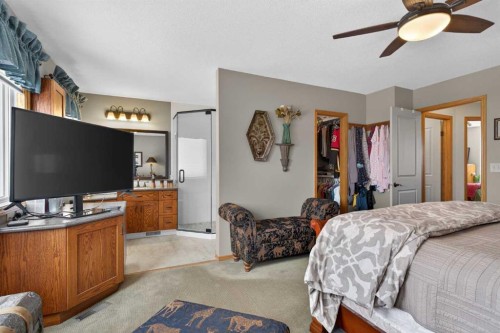 204 Sunrise Circle Se, Calgary, AB - Indoor Photo Showing Bedroom