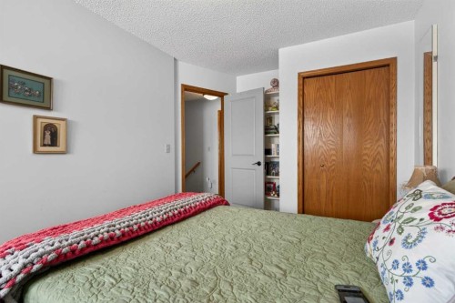 204 Sunrise Circle Se, Calgary, AB - Indoor Photo Showing Bedroom