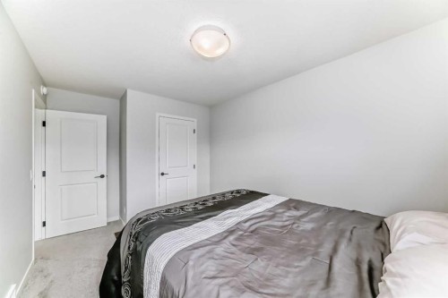 160 Lucas Common Nw, Calgary, AB - Indoor Photo Showing Bedroom